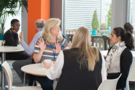 Participants having animated discussions at a networking event